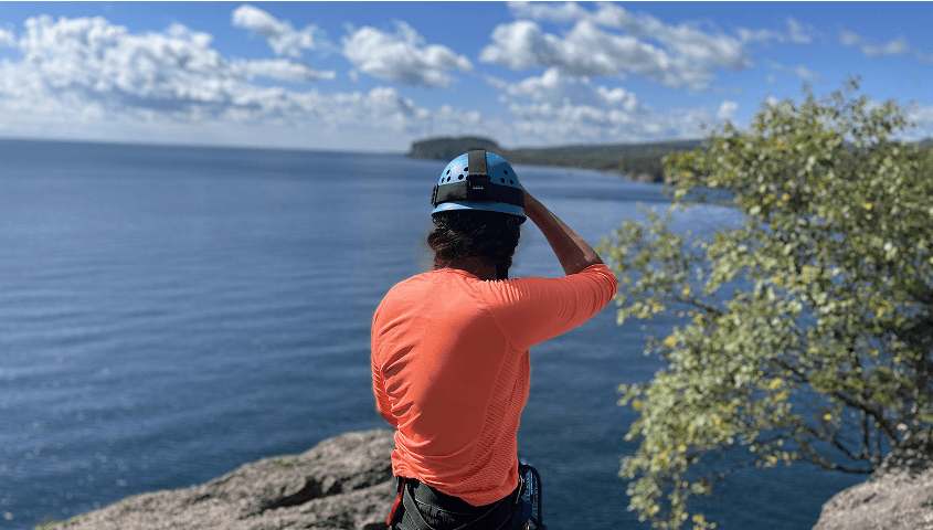Climber looking at Lake Superior
